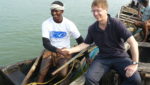 Dr David Agnew with a clam fisher on the Ashtamudi Estuary in Kerala, India