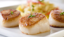 Seared sea scallops with orzo and vegetables. Credit: Northern Wind