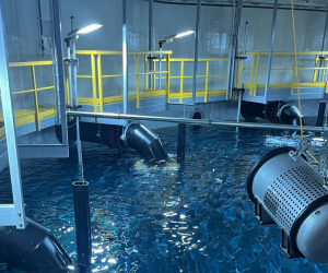 One of Salmon Evolution’s tanks in early August houses Atlantic salmon at 4kg weight and will be harvested in a week. Of the three pumps in the background, two pump recirculated water into the facility. A third will inject new water into the system.